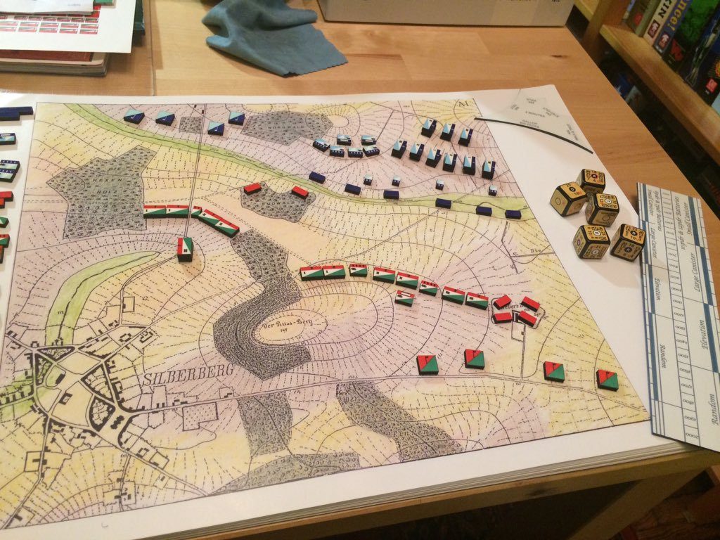 A reconstruction of the 1824 Prussian Kriegsspiel played on a map with wooden blocks and dice